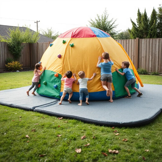 Kids climbing an outdoor dome with safe ground mats and adult supervision