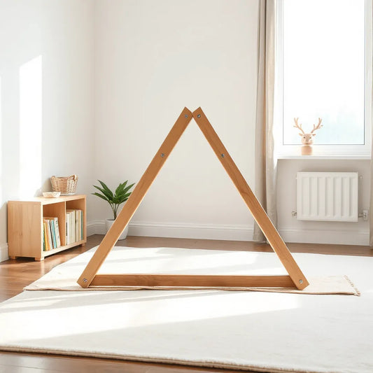 Wooden climbing triangle set on a soft mat in a bright indoor playroom