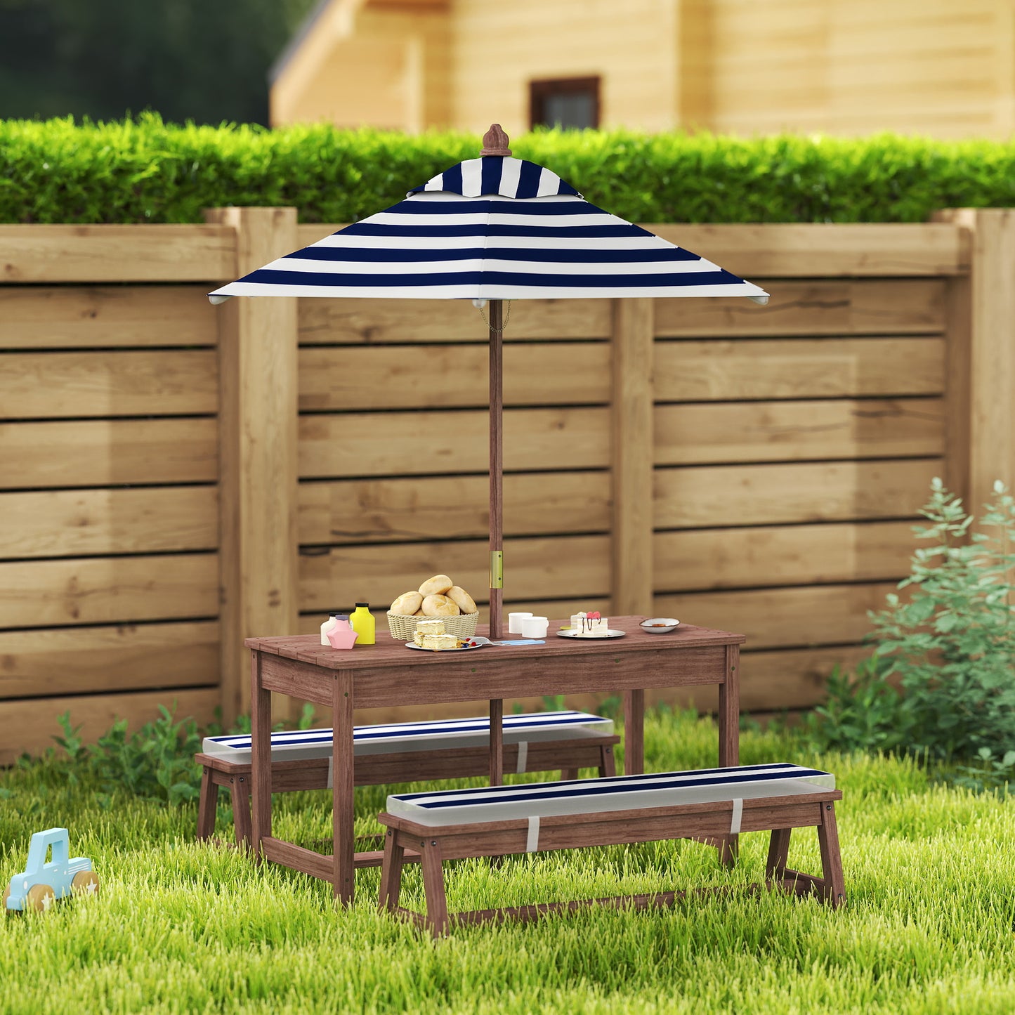 Little Play World SunHaven™ kids outdoor picnic table set with two small benches on a grassy lawn.