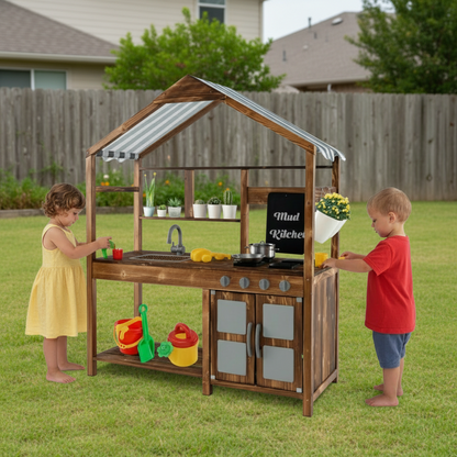 Children playing with a wooden play kitchen set outdoors.