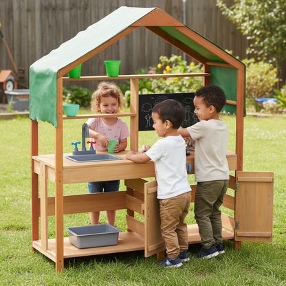 Children playing in a wooden playhouse with a sink and chalkboard in a backyard.