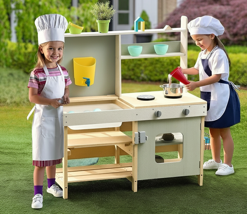 Children playing with a toy kitchen set outdoors