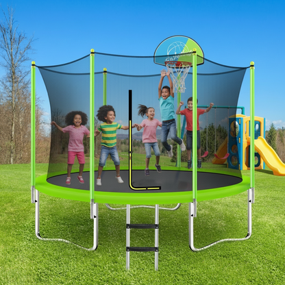 Children playing on a trampoline with a basketball hoop and slide in a park setting.