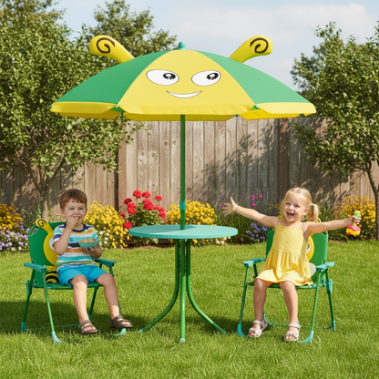 Two children sitting under a colorful umbrella and table set in a garden.