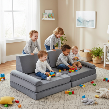 Children playing on a gray sectional sofa in a living room with toys scattered around.