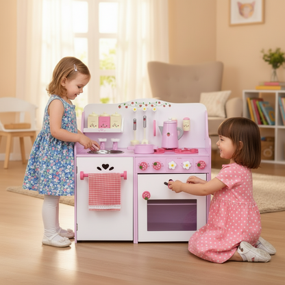 Two children playing with a pink toy kitchen set in a room.