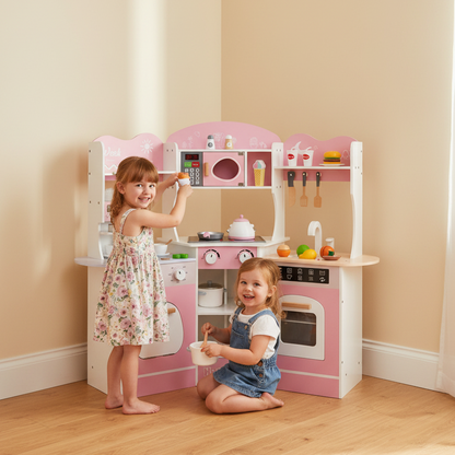 Two children playing with a pink toy kitchen set in a room with beige walls and wooden floor.