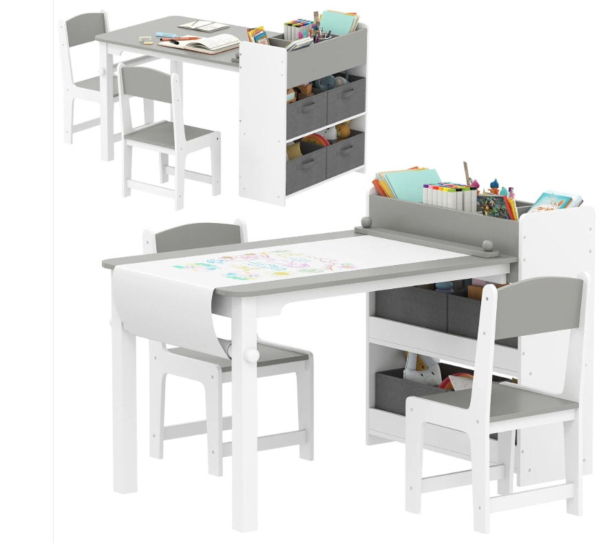 Children's table and chair set with storage bins on a white background