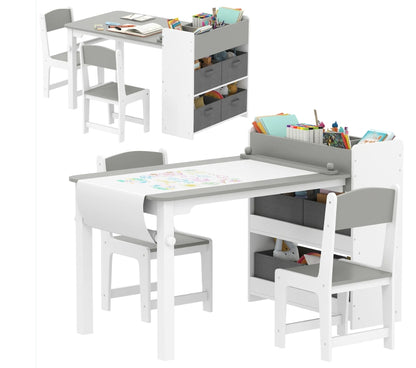 Children's table and chair set with storage bins on a white background