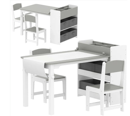 White and gray children's table and chair set with storage bins on a white background