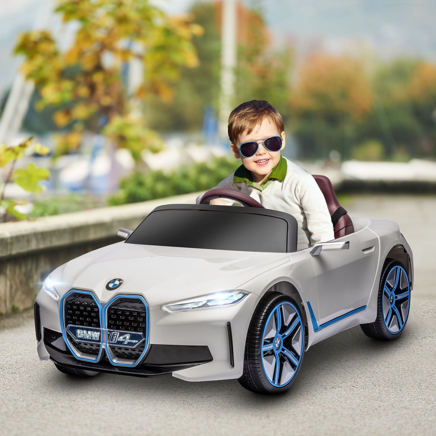 White BMW LuxeDrive™ 12V kids electric ride-on car with parental remote control, designed for children by Little Play World.