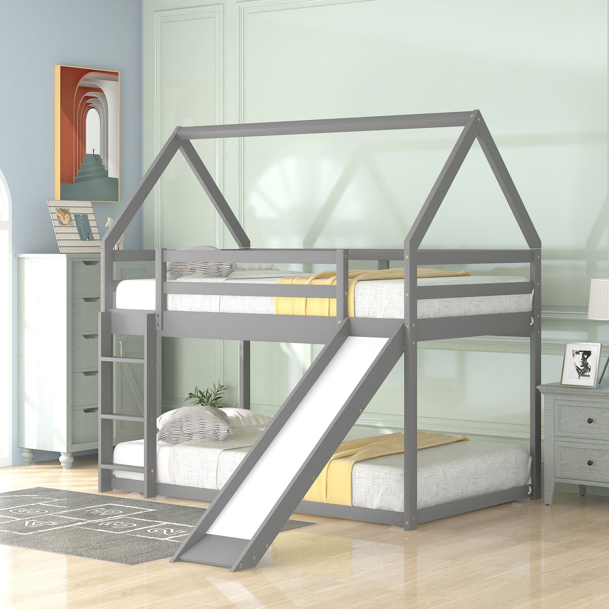 White DreamHaven Twin Over Twin House Bunk Bed with slide and ladder, featuring easy access and playful design for kids' bedroom.
